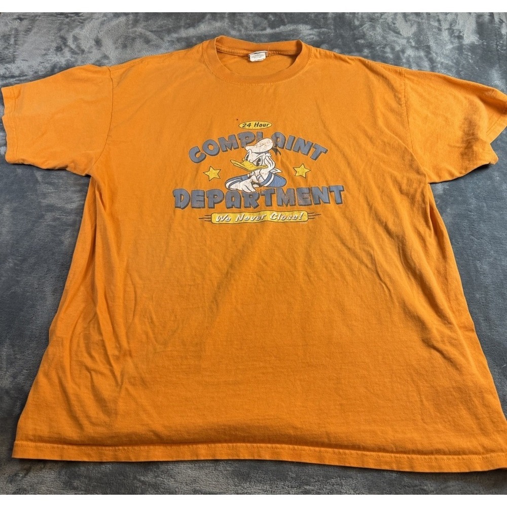 Disney Store Donald Duck T-shirt. 2XL "Complaint Dept Always Open"Orange/Peach